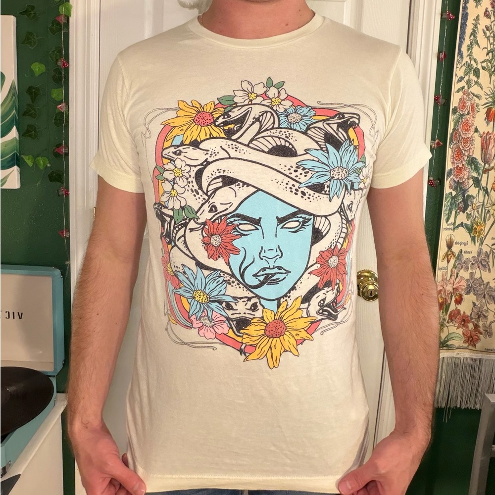 EARTHBOUND Cream Tee with Vibrant Floral Graphic